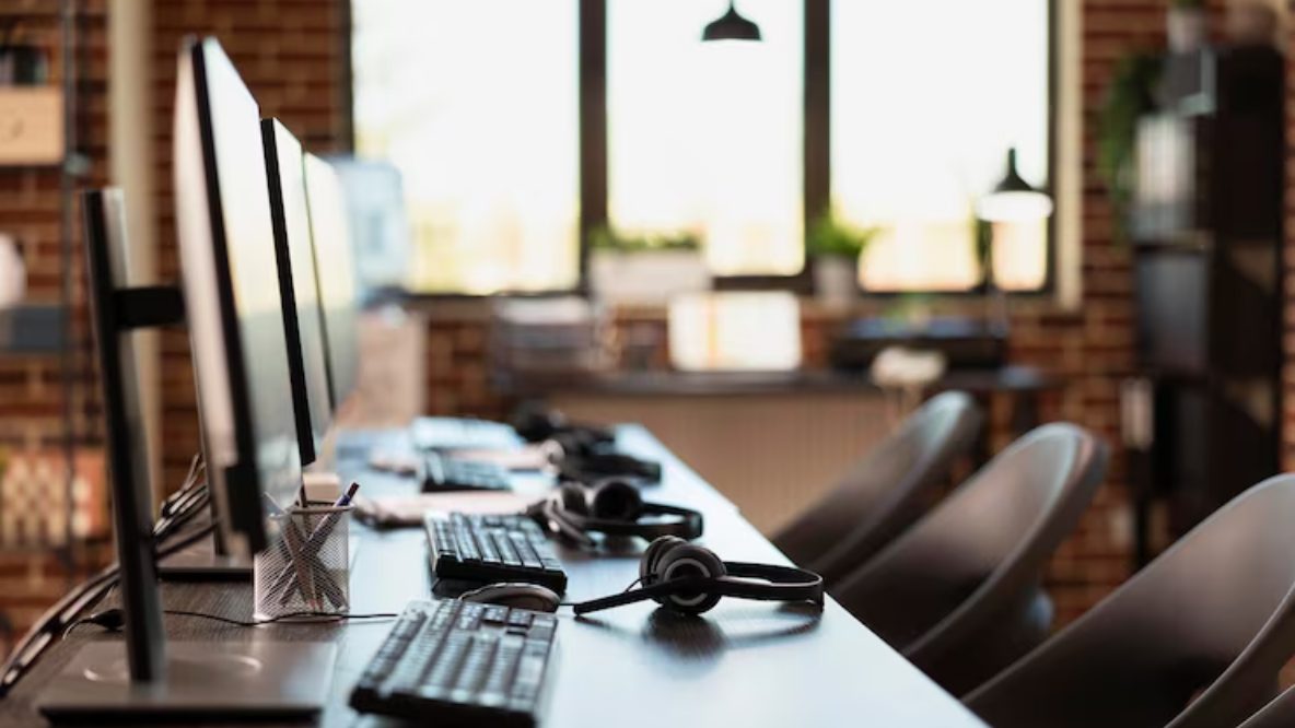 Desks and headsets set up ready for a Sphere Sync Connect recruitment support team